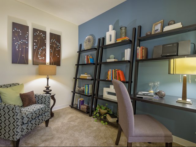 Posh interiors with 2" stylized blinds, built-in bookshelves and den options at Coppermill Park Apartments