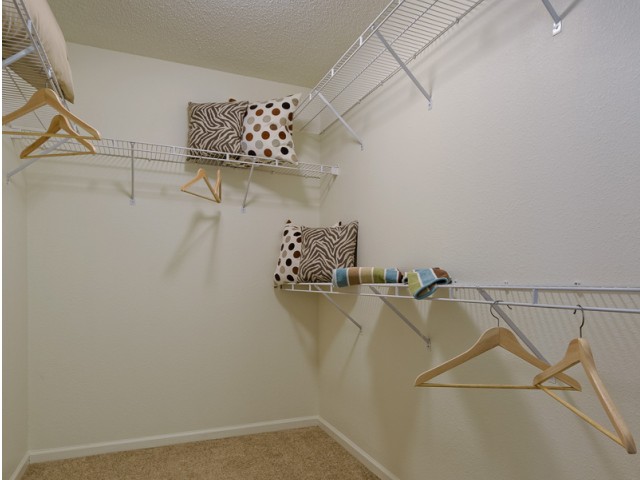 Walk in closets offer plenty of hanging and storage space