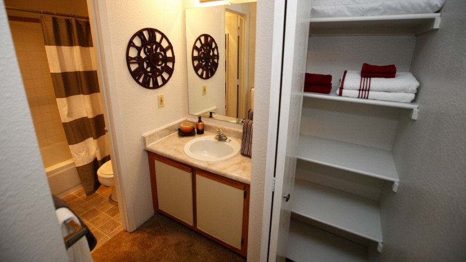 Bathrooms are enhanced by their ample storage closets