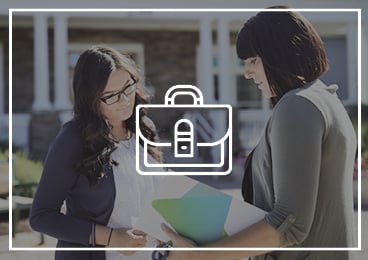 Briefcase Icon | Winn Employees conversing outside building