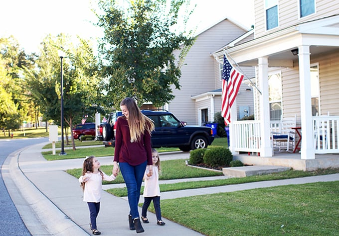 Woman with two children walking
